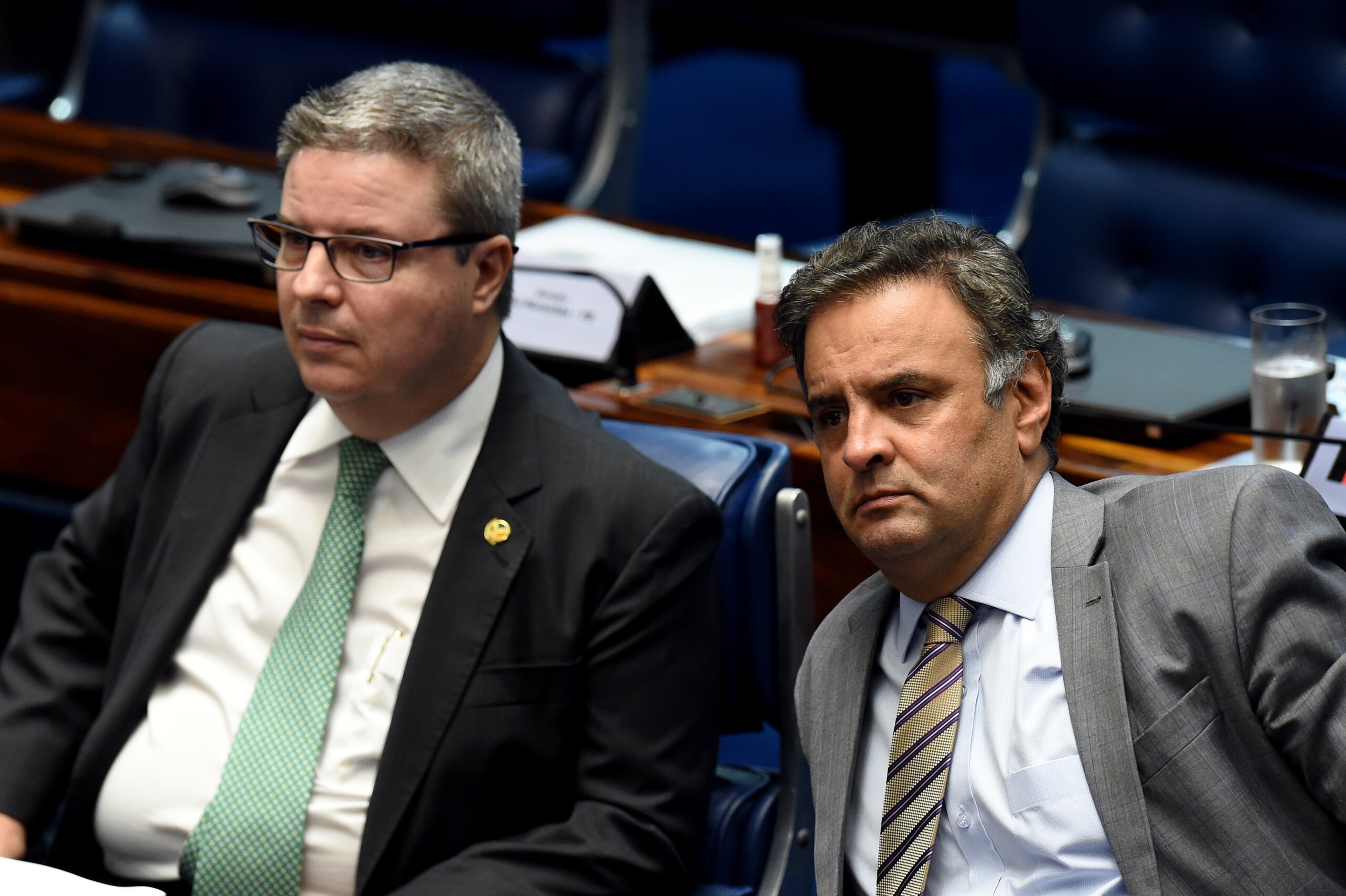 Senator Aecio Neves (R), who heads the PSDB opposition party, sits next to senator Antonio Anastasia, also from the PSDB, during a senate's session to form a committee that will consider whether to impeach President Dilma Rousseff, in Brasilia, on April 25, 2016.<br /><br /><br /><br /><br /><br /><br />
Brazil's Senate met Monday to form a committee that will consider whether to impeach Rousseff, who has accused her opponents of mounting a constitutional coup. She is accused of illegal government accounting maneuvers, but says she has not committed an impeachment-worthy crime. The Senate committee -- comprising 21 of the 81 senators -- was to debate Rousseff's fate for up to 10 working days before making a recommendation to the full upper house.<br /><br /><br /><br /><br /><br /><br />
 / AFP / EVARISTO SA        (Photo credit should read EVARISTO SA/AFP/Getty Images)