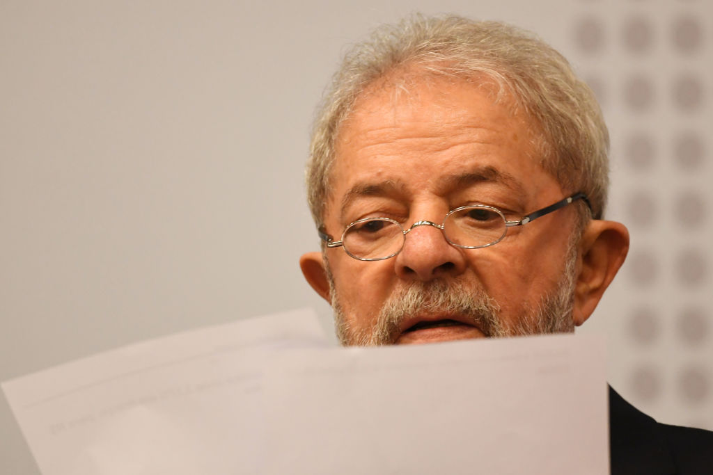 Former Brazilian President (2003-2010) Luiz Inacio Lula da Silva reads during a seminar on "Strategies for the Brazilian Economy" promoted by the Workers' Party in Brasilia, on April 24, 2017.<br /><br /><br /><br />
Lula da Silva, who faces allegations of involvement in the Odebratch scandal, had his graft probe testimony postponed to May 10. / AFP PHOTO / EVARISTO SA        (Photo credit should read EVARISTO SA/AFP/Getty Images)