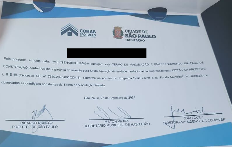 Termo de vinculação recebido durante o evento da Prefeitura de São Paulo.